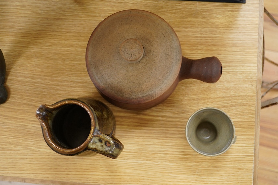 Three pieces of St Ives Leach pottery to include a jug, a mug and a casserole pot. Condition - fair, chipp rb